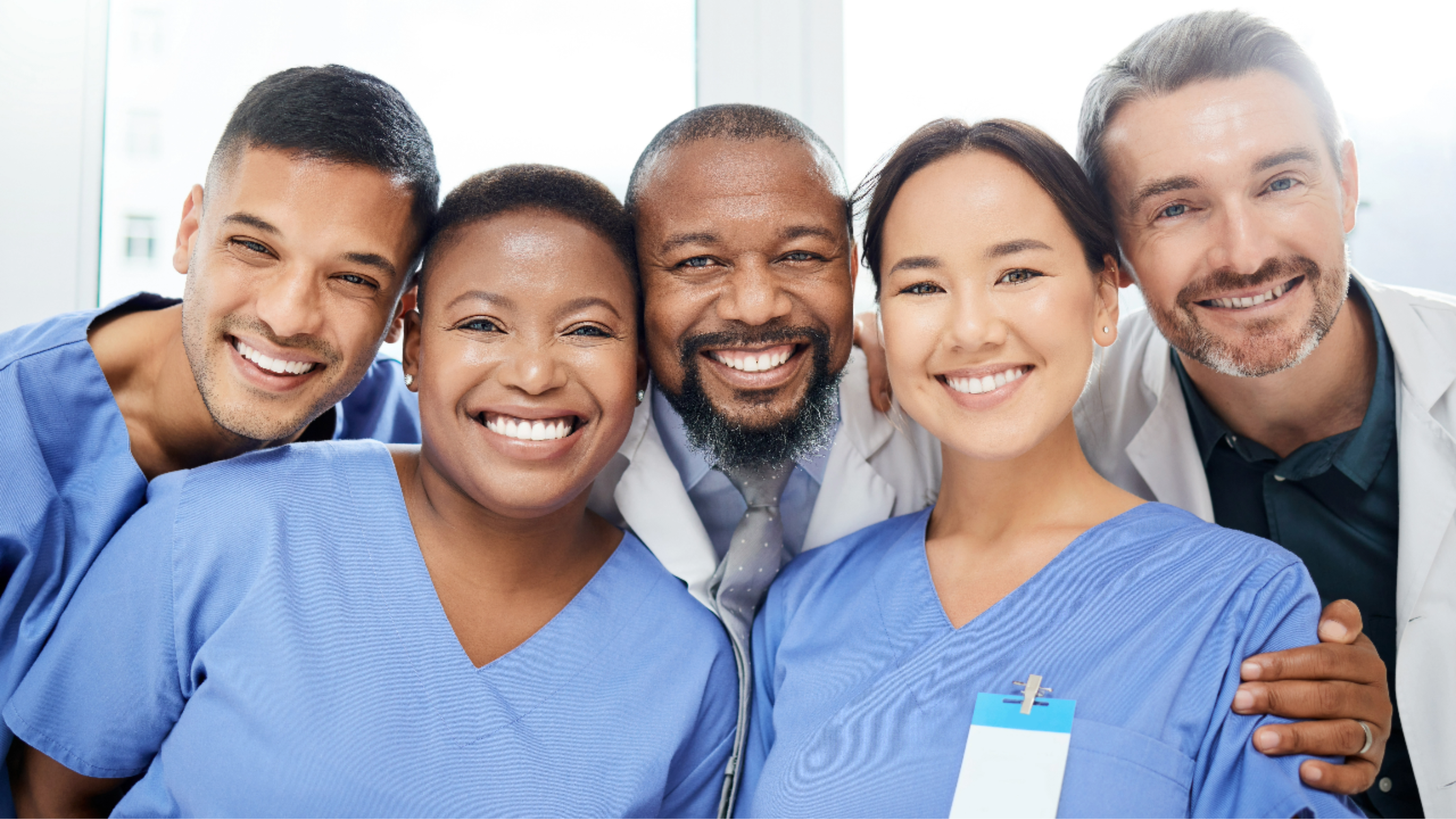 Image: A joyful hospital care team working collaboratively under the guidance of strong and compassionate leadership.