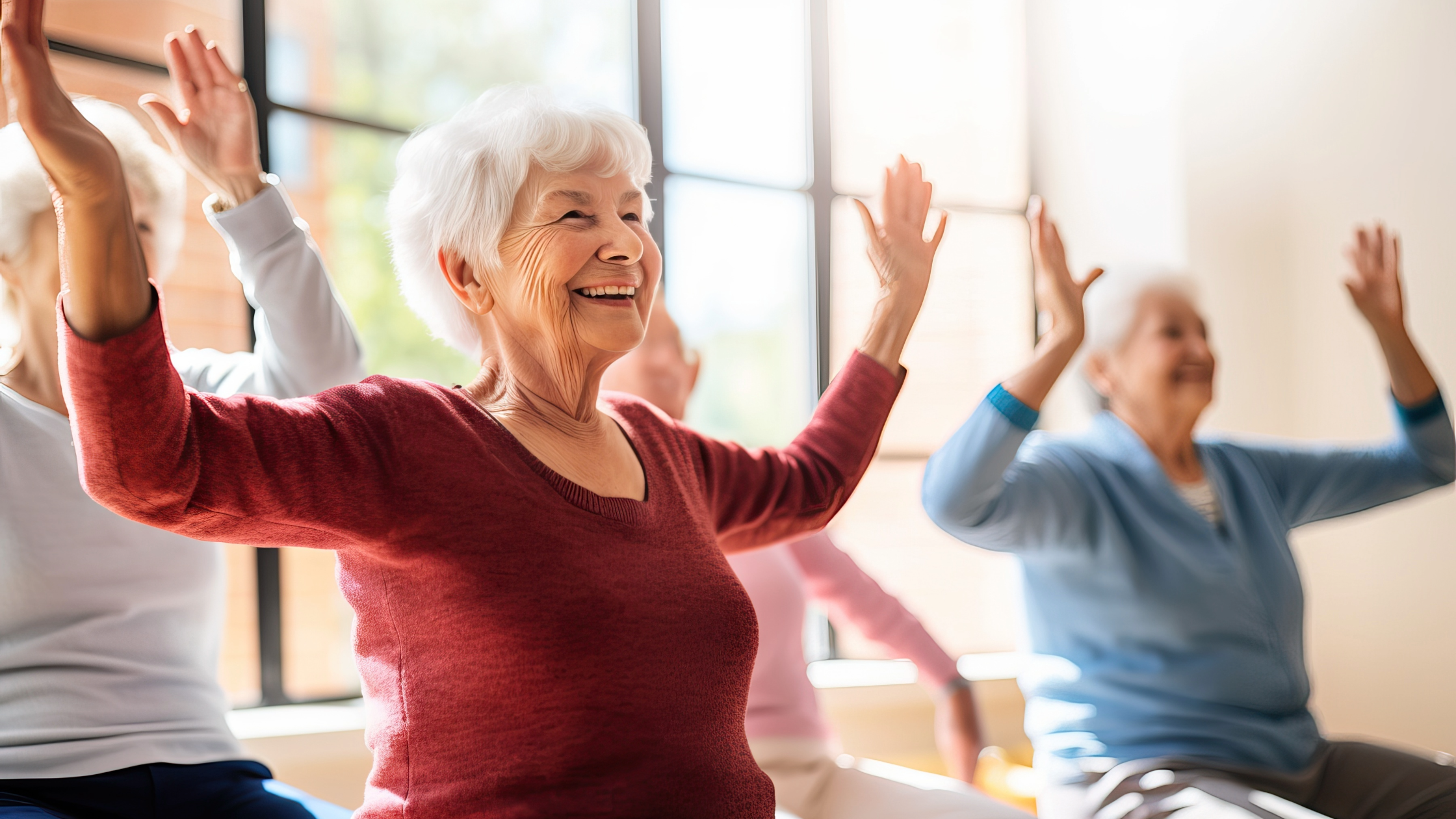 A group of seniors enthusiastically engages in exercise, showcasing the positive impact of patient engagement among the elderly. The image captures a moment of community and well-being as seniors participate in various exercises, promoting physical activity and social connection for a healthier and happier lifestyle